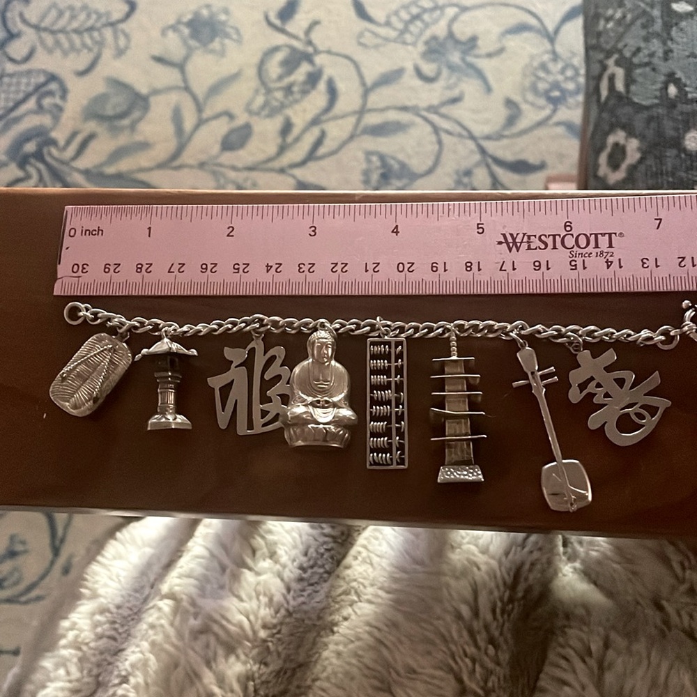 Rare, one of the kind, gorgeous vintage sterling charm bracelet.